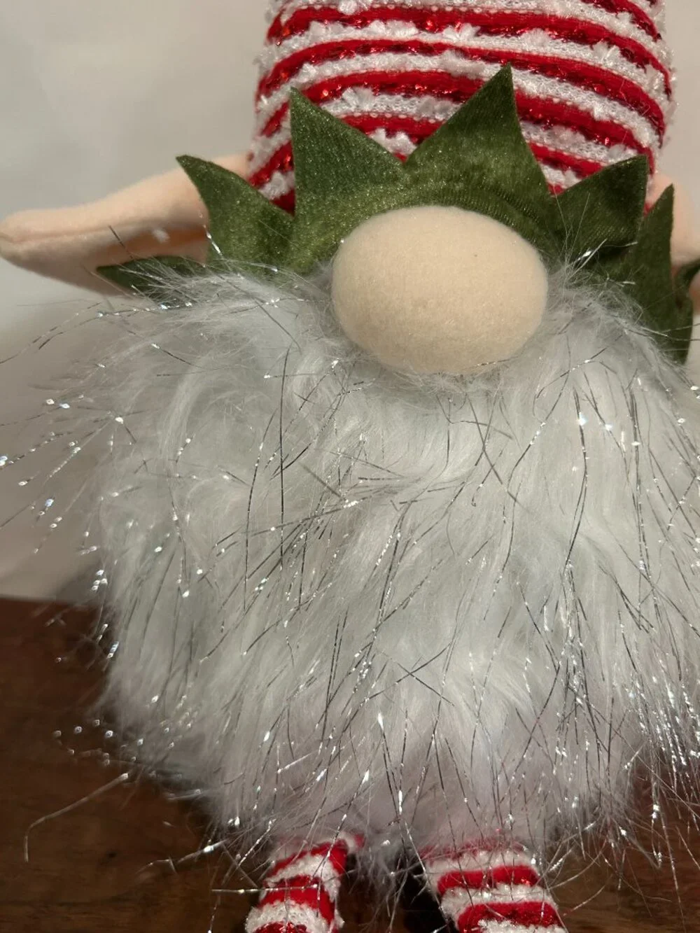 Christmas Holiday Gnome with red and white striped cap and wispy, sparkly white
